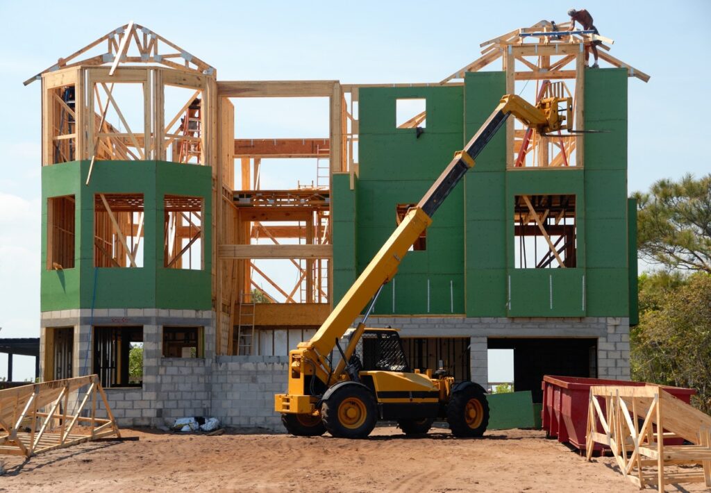 This article addresses the question 'How much does it cost to build a house?' The image depicts a stage in the building process of a house.